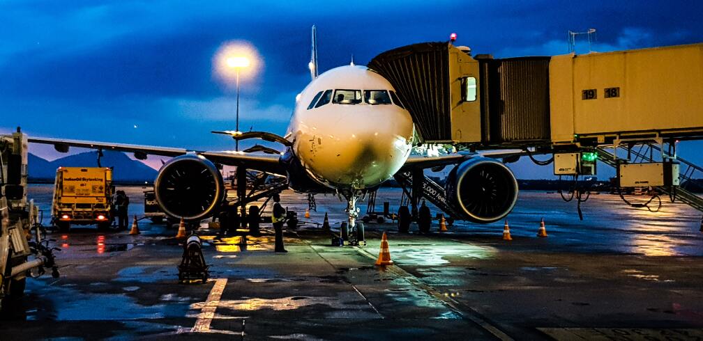 Airplane at an airport gate.